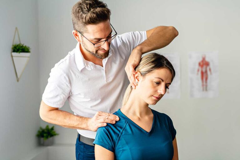 Person discussing digestive symptoms with a healthcare provider in a bright examination room.